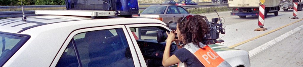 Kamerafrau Polizeiauto
